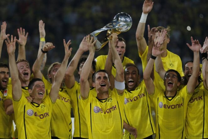 Triumfuojantys Dortmundo komandos futbolininkai | AP/Scanpix nuotr.