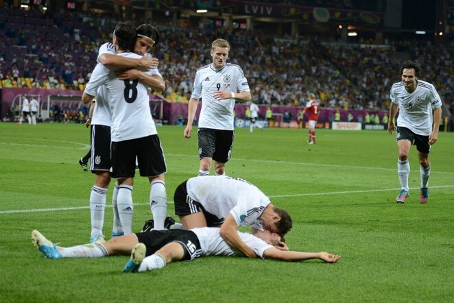 Triumfuojantys Vokietijos rinktinės futbolininkai | AFP/Scanpix nuotr.
