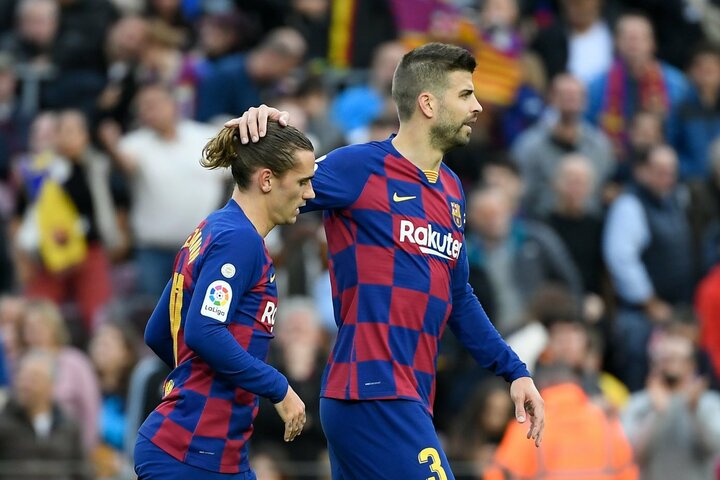 Gerardas Pique ir puolėjas Antoine'as Griezmannas (kairėje) | Scanpix nuotr.